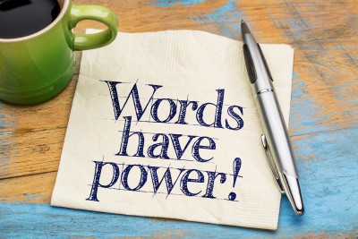 Words have power - handwriting on a napkin with cup of coffee